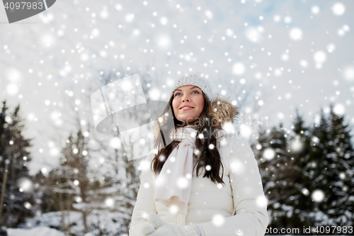 Image of happy woman outdoors in winter