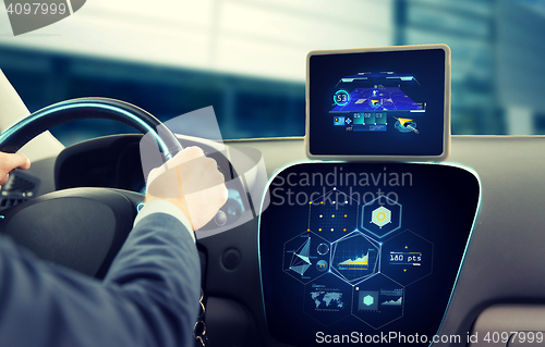 Image of close up of man driving car with navigation system