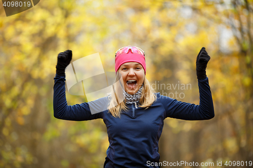 Image of Young happy woman doing exercises