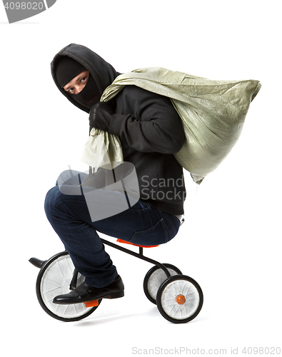 Image of Thief with bag on bicycle