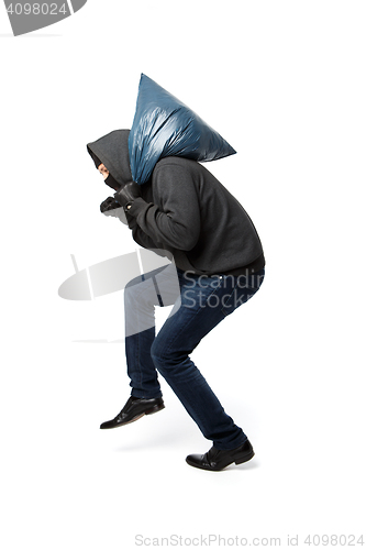 Image of Robber slinking with large bag