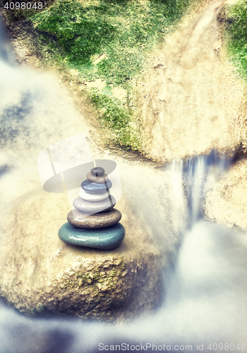 Image of Rock Zen Stack in front of waterfall.