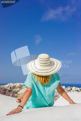 Image of Young woman on holidays, Santorini Oia town 