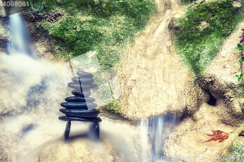 Image of Rock Zen Stack in front of waterfall.