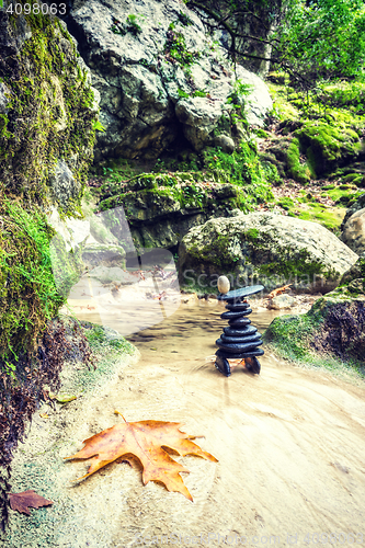 Image of Rock Zen Stack in front of waterfall.