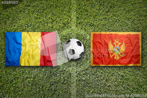 Image of Romania vs. Montenegro flags on soccer field