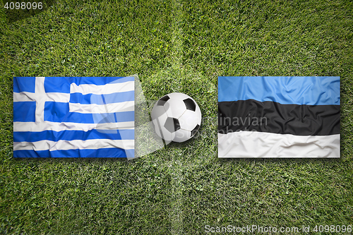 Image of Greece vs. Estonia flags on soccer field