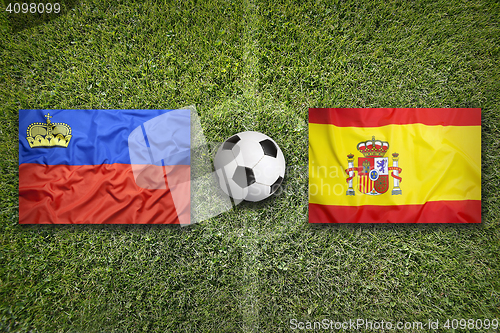 Image of Liechtenstein vs. Spain flags on soccer field