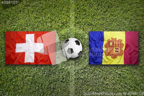 Image of Switzerland vs. Andorra flags on soccer field