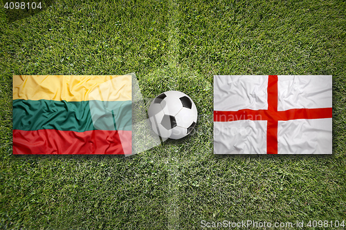 Image of Lithuania vs. England flags on soccer field