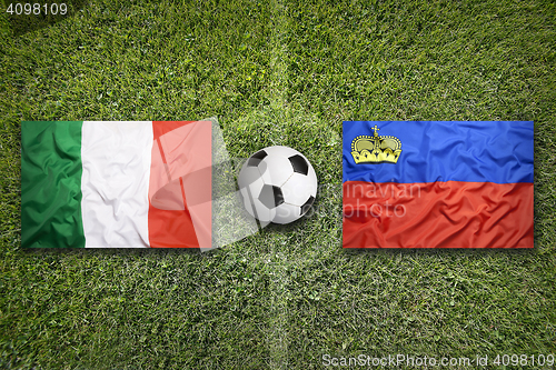 Image of Italy vs. Liechtenstein flags on soccer field