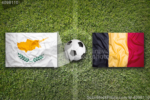 Image of Cyprus vs. Belgium flags on soccer field