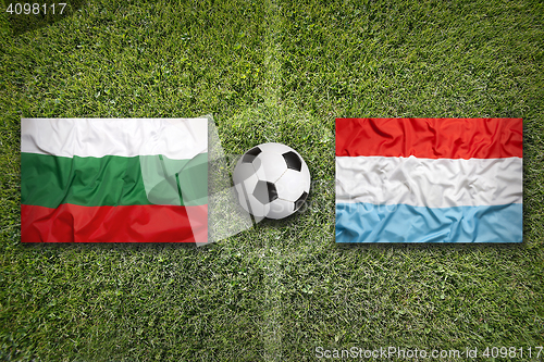 Image of Bulgaria vs. Luxembourg flags on soccer field