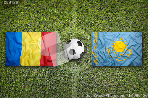 Image of Romania vs. Kazakhstan flags on soccer field
