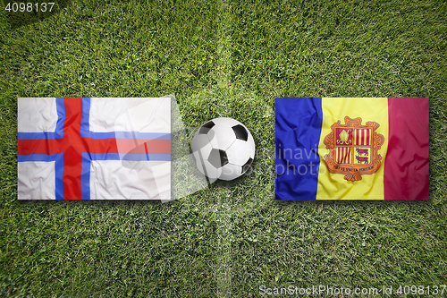 Image of Faroe Islands vs. Andorra flags on soccer field