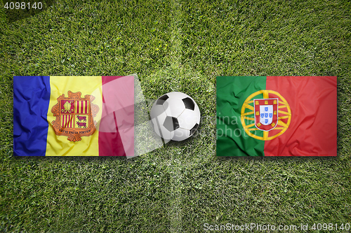 Image of Andorra vs. Portugal flags on soccer field