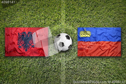 Image of Albania vs. Liechtenstein flags on soccer field