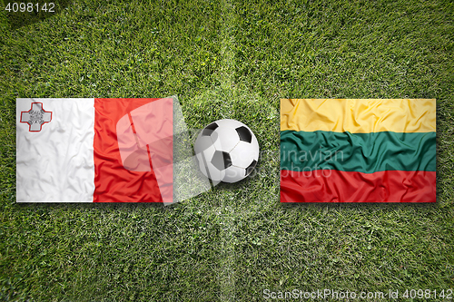 Image of Malta vs. Lithuania flags on soccer field
