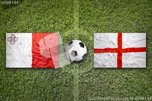 Image of Malta vs. England flags on soccer field