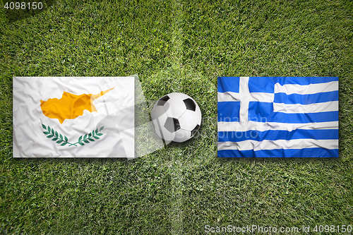 Image of Cyprus vs. Greece flags on soccer field