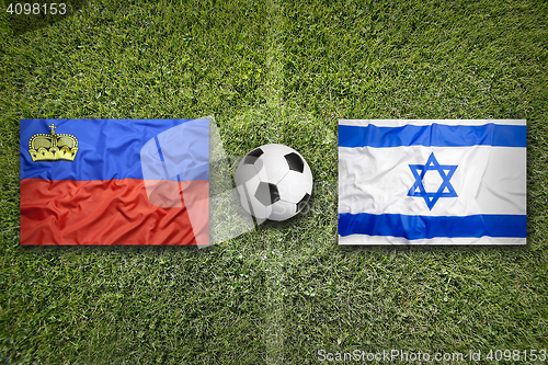 Image of Liechtenstein vs. Israel flags on soccer field