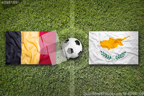 Image of Belgium vs. Cyprus flags on soccer field