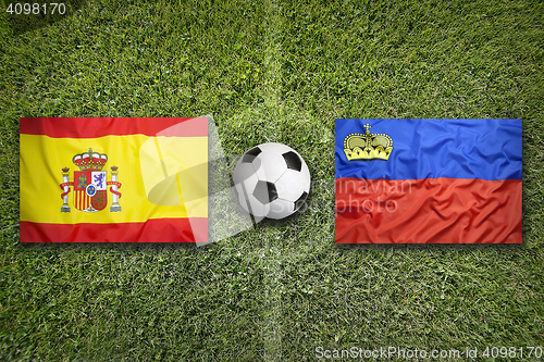 Image of Spain vs. Liechtenstein flags on soccer field