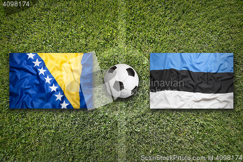 Image of Bosnia and Herzegovina vs. Estonia flags on soccer field