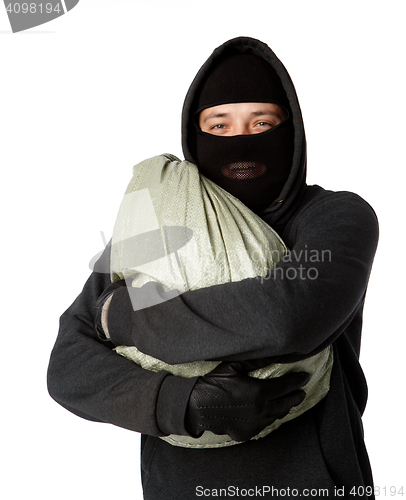 Image of Burglar is holding large bag