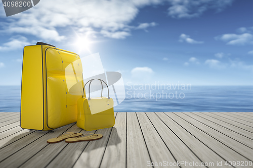 Image of some luggage on a wooden jetty