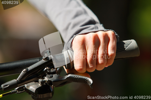 Image of Woman hands on modern sport bike