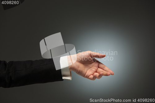 Image of Dressed in a business suit caucasian male hand