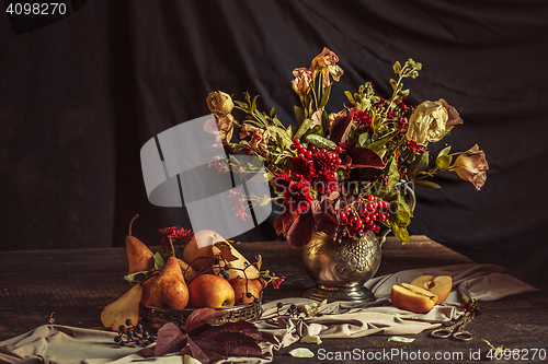 Image of Still life with apples and autumn flowers