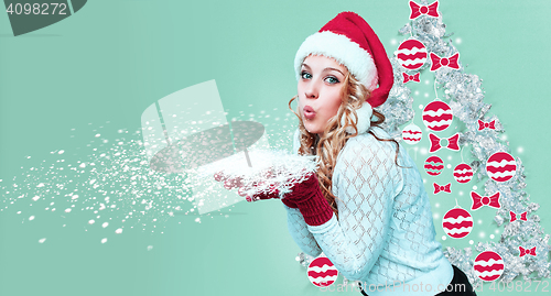 Image of Beautiful young woman in Santa Claus clothes with snowflakes