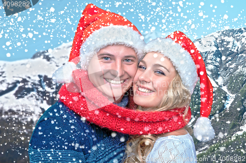 Image of Lovely christmas couple in Santa Claus hats