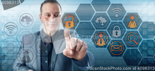 Image of Smiling Happy Businessman Unlocking Data Access