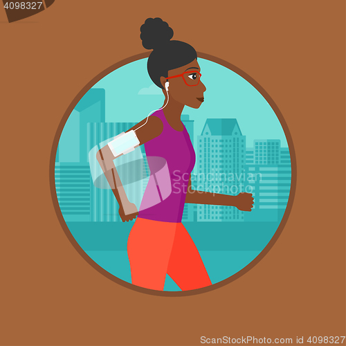 Image of Woman running with earphones and smartphone.