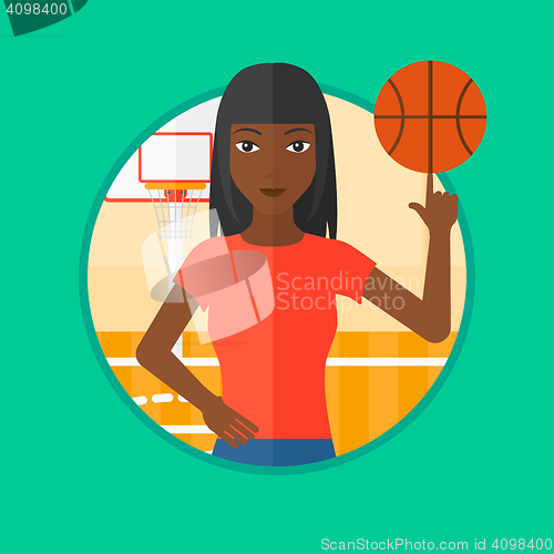 Image of Basketball player spinning ball.