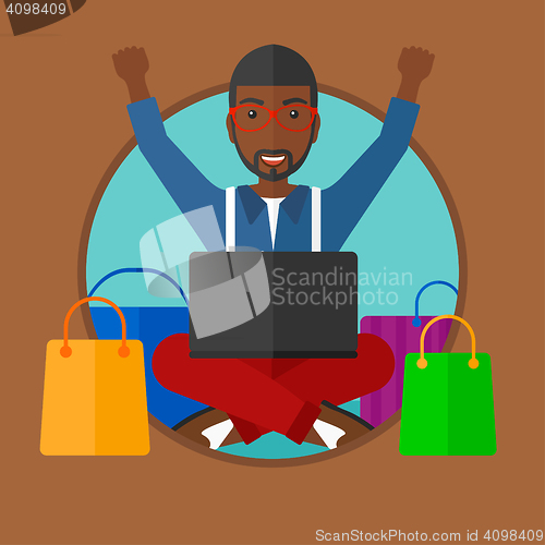 Image of Man shopping online using his laptop.