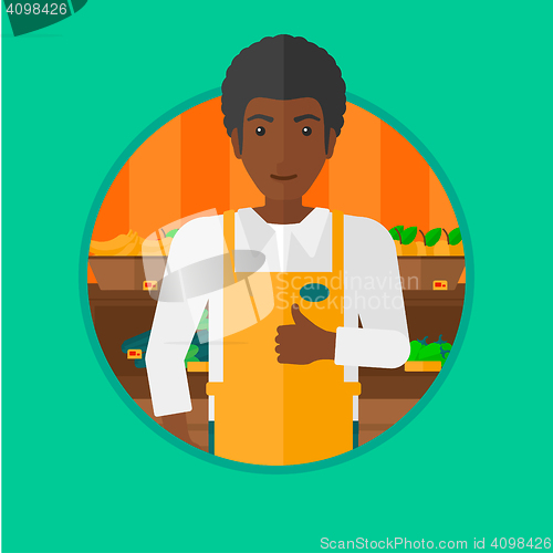 Image of Friendly supermarket worker giving thumb.
