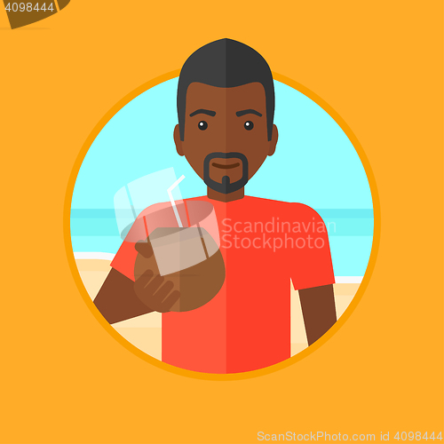 Image of Man drinking coconut cocktail on the beach.