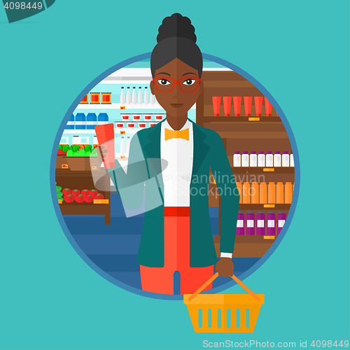 Image of Customer with shopping basket and tube of cream.