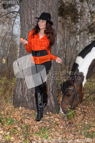 Image of Young Woman And Horse