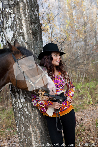 Image of Young Woman And Horse