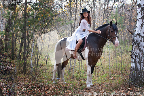 Image of Young Woman And Horse