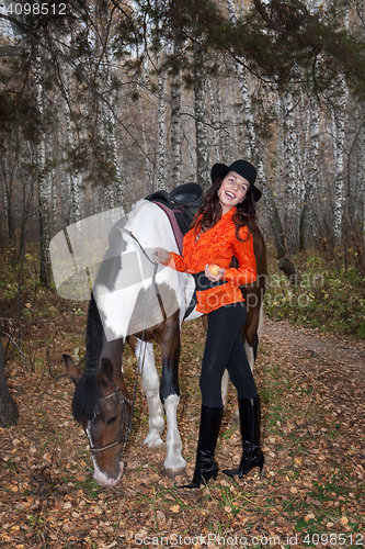 Image of Young Woman And Horse