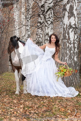 Image of Young Woman And Horse