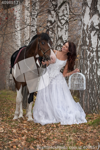 Image of Young Woman And Horse