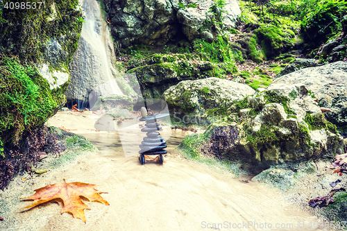 Image of Rock Zen Stack in front of waterfall.