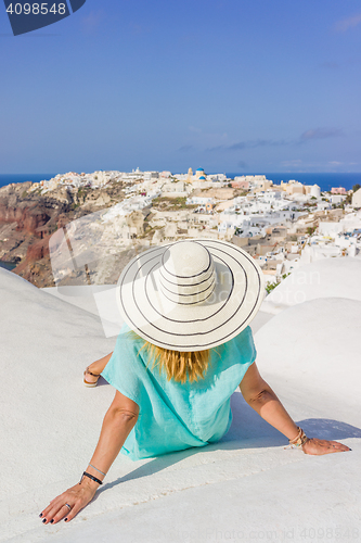 Image of Young woman on holidays, Santorini Oia town 